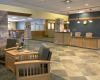 The reception area illustrates the continuation of the Prairie Style design and use of appropriate materials.
