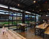 Overhead and sliding doors allow open-air seating in warm months