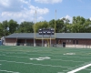 Field-level view of the new stadium fieldhouse. The project included new home and visitor seating areas