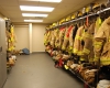 Turnout gear is kept at the ready in a separate storage room.